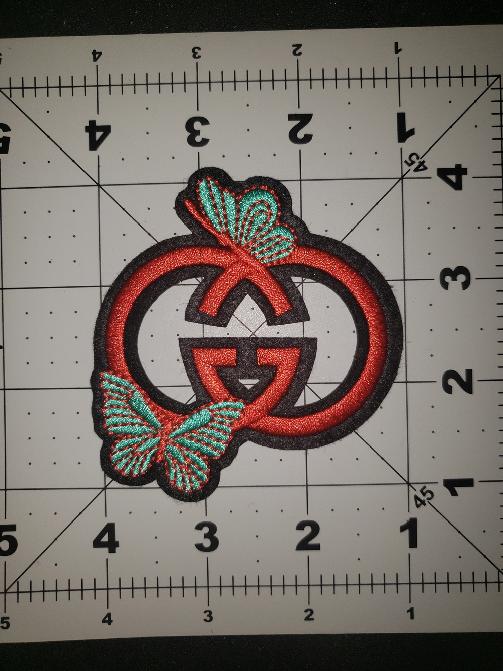 Gucci Embroidered Red Double-Ring Patch with Teal Butterfly Accents